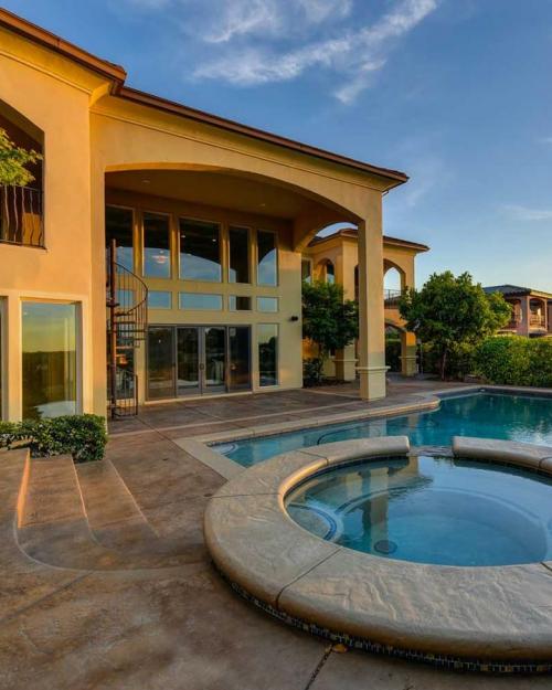 Mansion and pool at sunset