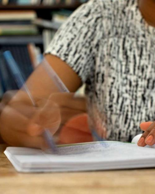 Person writing in a notebook