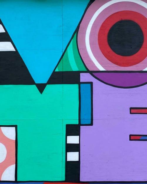 Colorful mural of the word "VOTE"