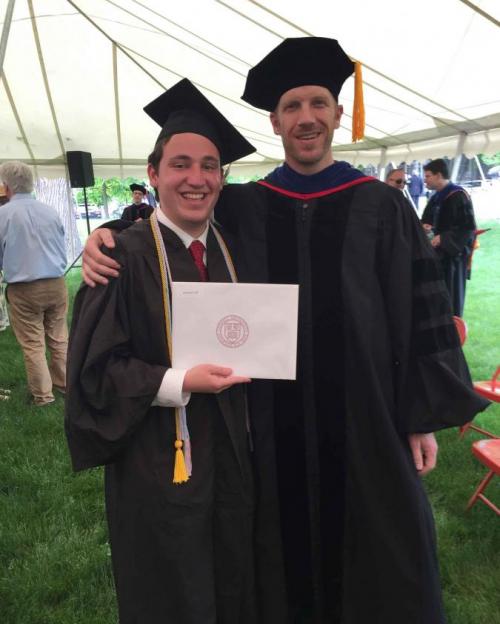 two people in graduation gowns
