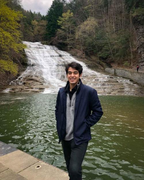 student at waterfall