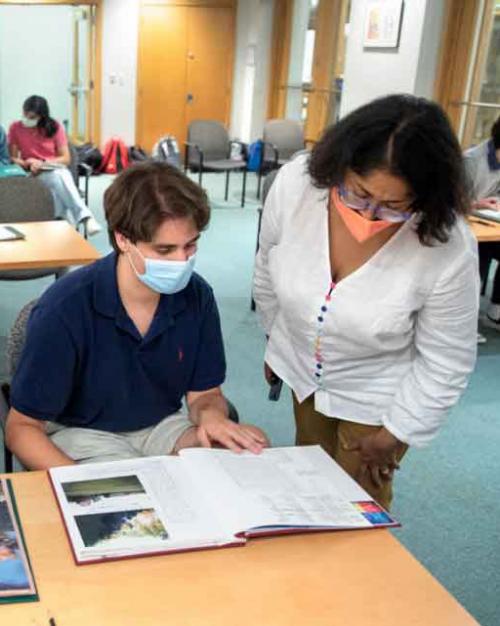 students look at a book