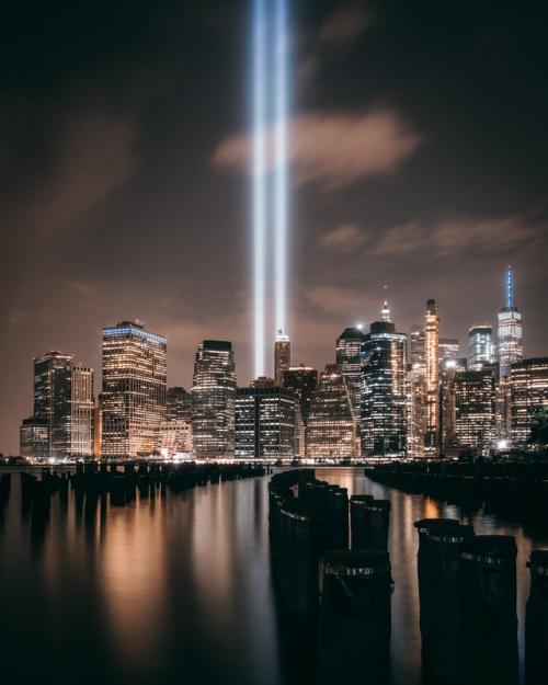 Beams of light memorializing the Twin Towers with the Manhattan skyline below.