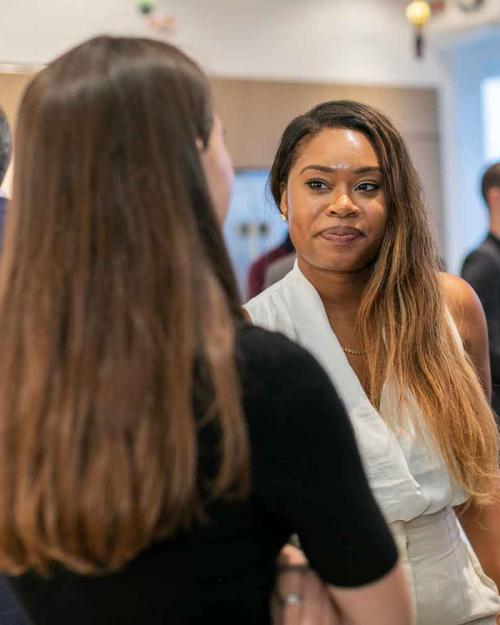 		three people talking
	