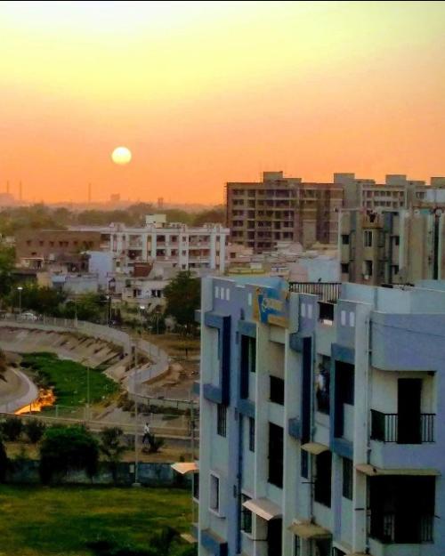 		Sun setting over a city
	