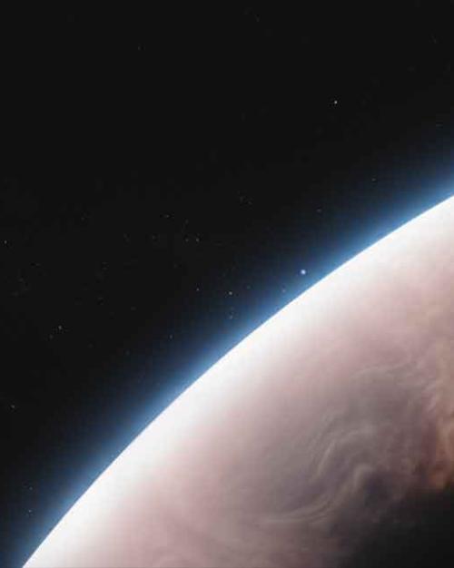 A pink-tinged crescent edge of a planet with a thin blue layer of atmosphere framed against the black emptiness of space