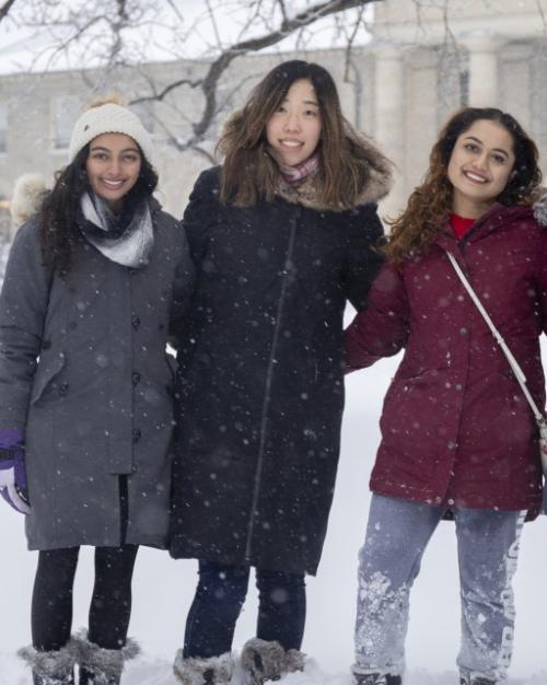 Five women standing in the snow