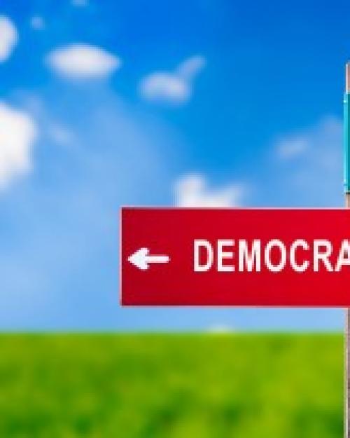 		Sign showing Populism going one way and democracy the other
	