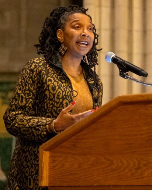 		Person speaking at a podium
	