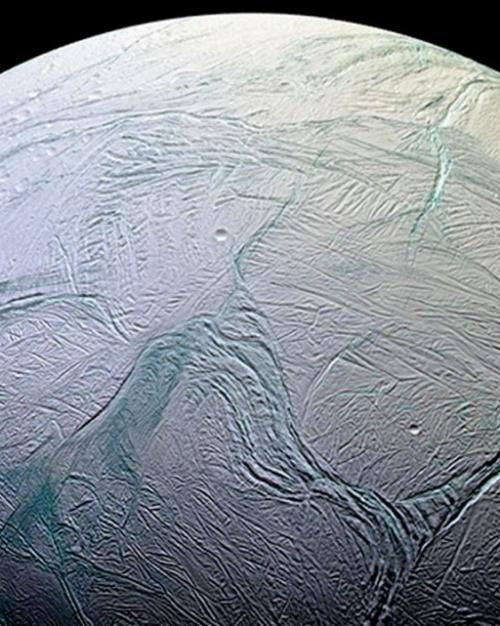 		The frozen ocean world of Enceladus, a moon of Saturn.
	
