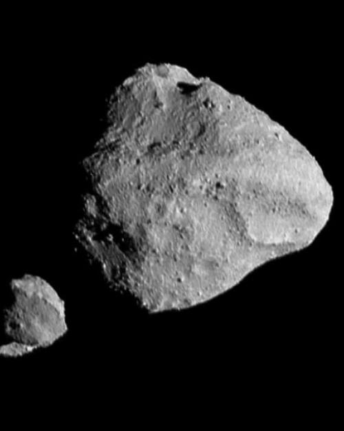 		Four rocky objects against a black background
	
