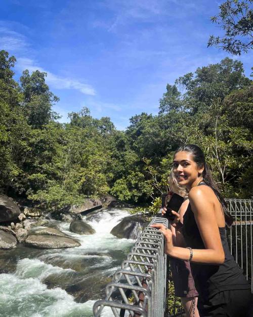 person standing by a stream