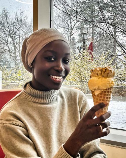 person eating ice cream cone