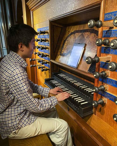 person playing an organ