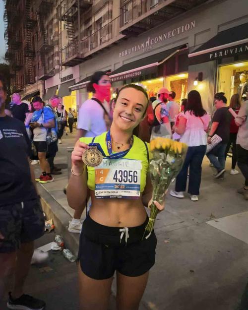 person holding medal from running a marathon