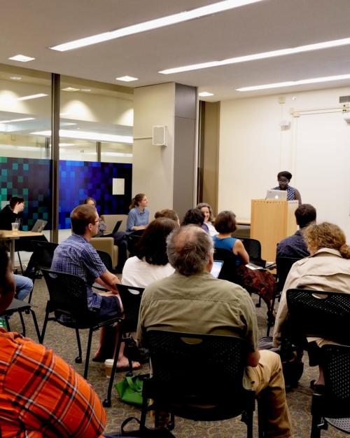 		Sevaral people sitting in a classroom
	