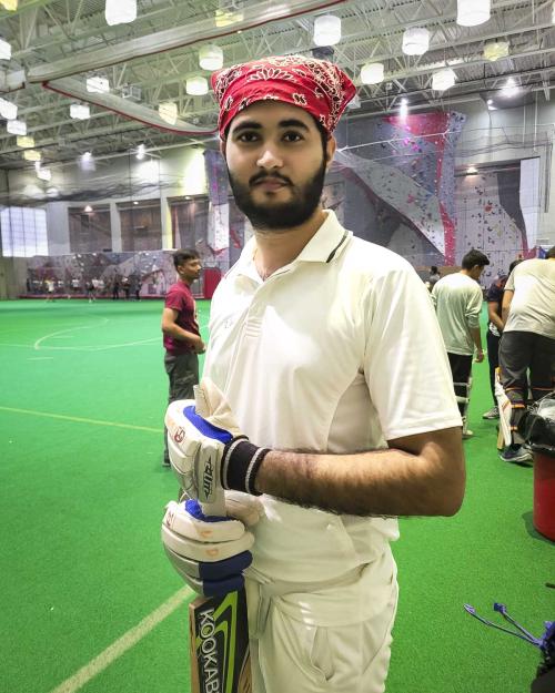 person holding cricket bat