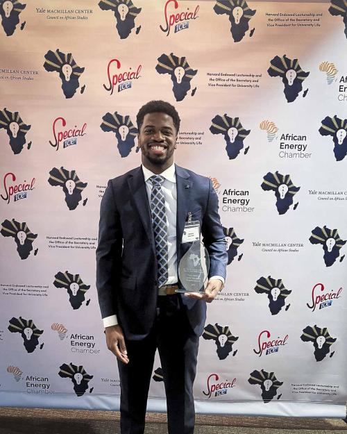 person standing with an award