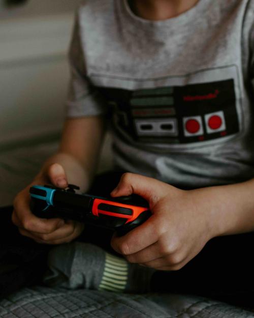 person holding a video game controller