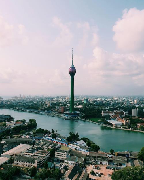 		A city at midday with a tower 
	