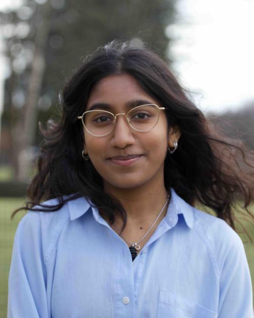 		Girl with blue Shirt and glasses 
	