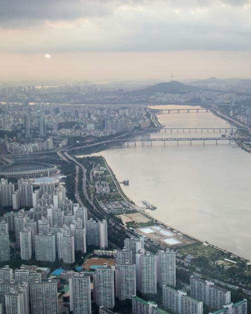 		A wide river running through a city
	