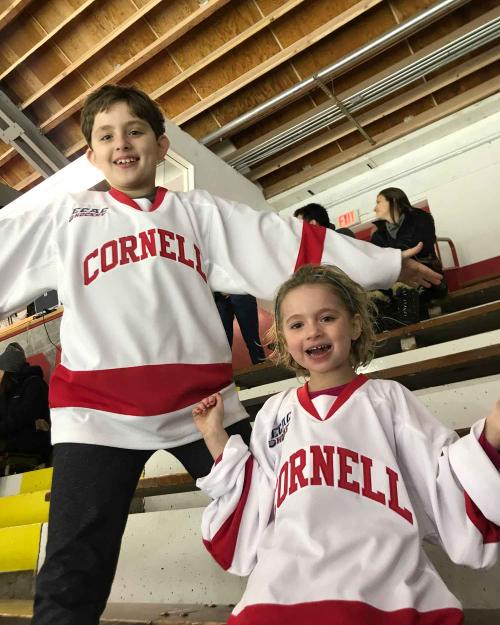 Two children wearing Cornell jerseys