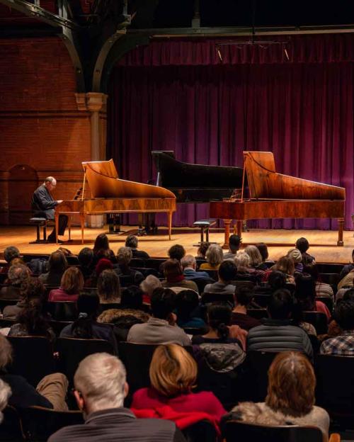 three pianos on a stage
