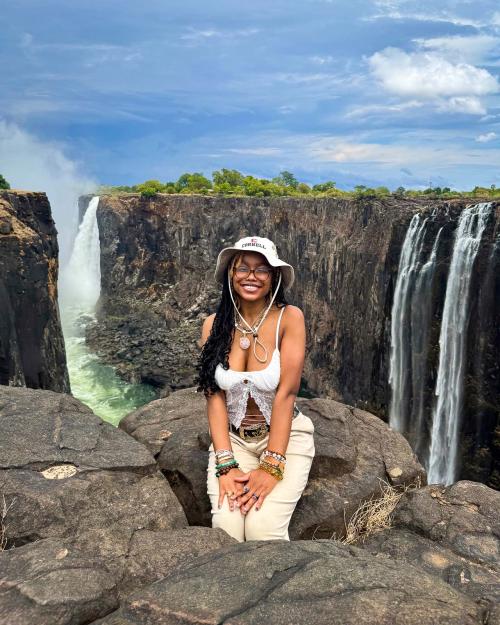 person sitting on rocks