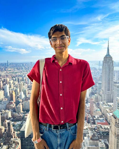 person standing with NYC in the background
