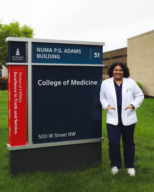 person outside medical school building
