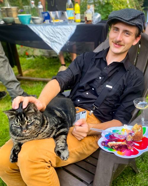 person with cat on his lap