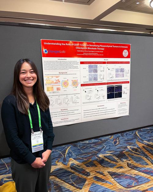 person with research poster