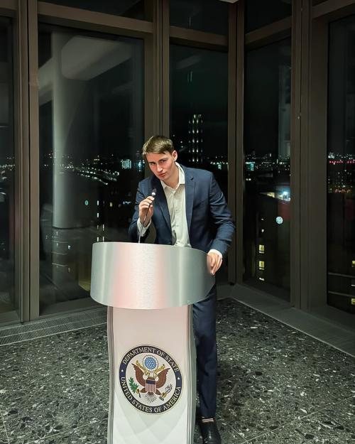 person at podium