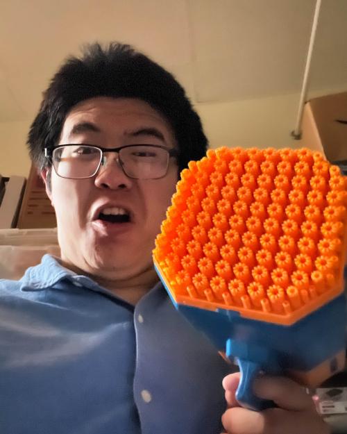 person holding an orange object