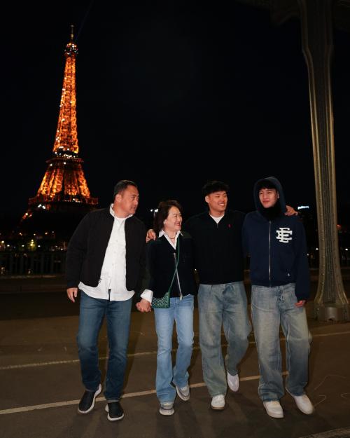 people with Eiffel Tower in background