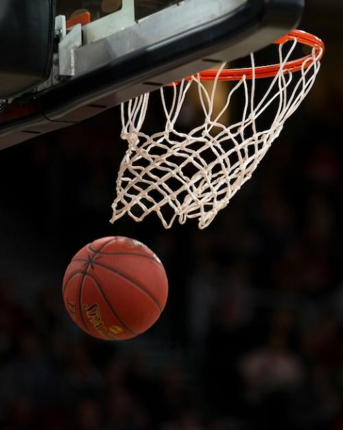 Basketball going through a net