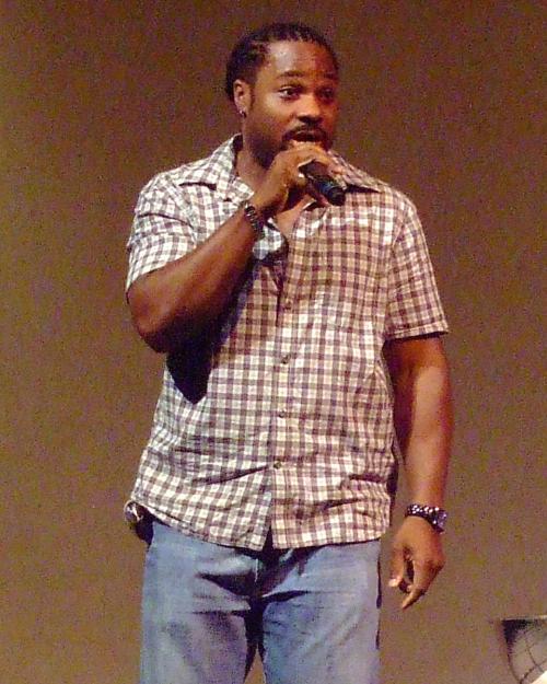 		Person speaking into a microphone
	