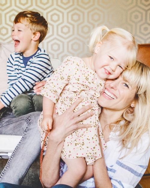 		Family of five on and in front of a couch
	
