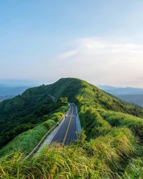 Grassy hill with a road leading up it: Scene from Taiwan