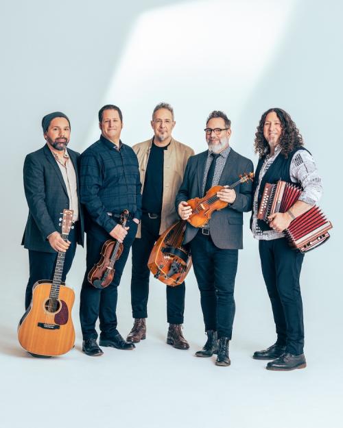 		Five musicians hold folk instruments in a publicity portrait
	