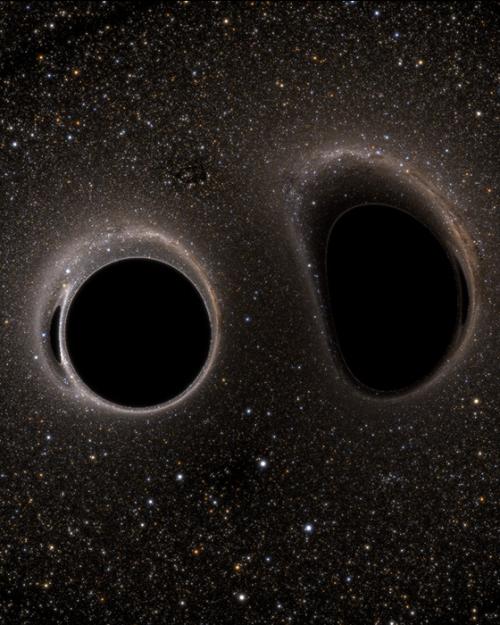 		two black holes approach each other with a dark background of space
	