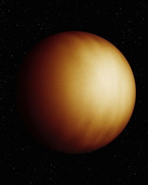 Golden sphere (a planet) against a black backdrop (space)