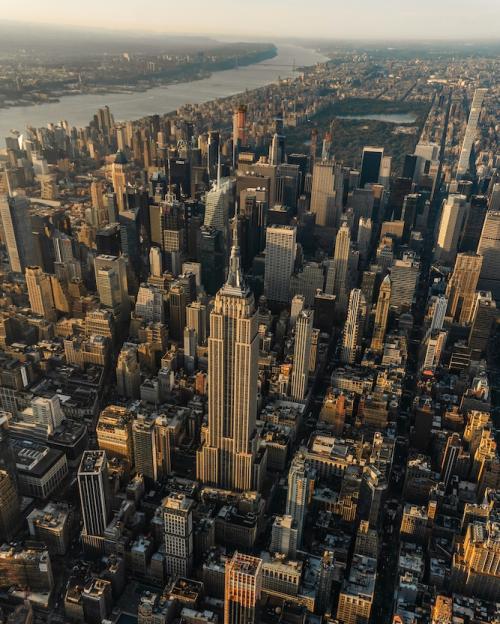 		Sky scrapers rise from New York City in an aeriel shot
	