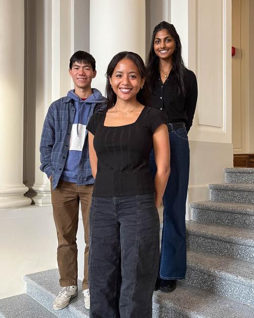three people smiling