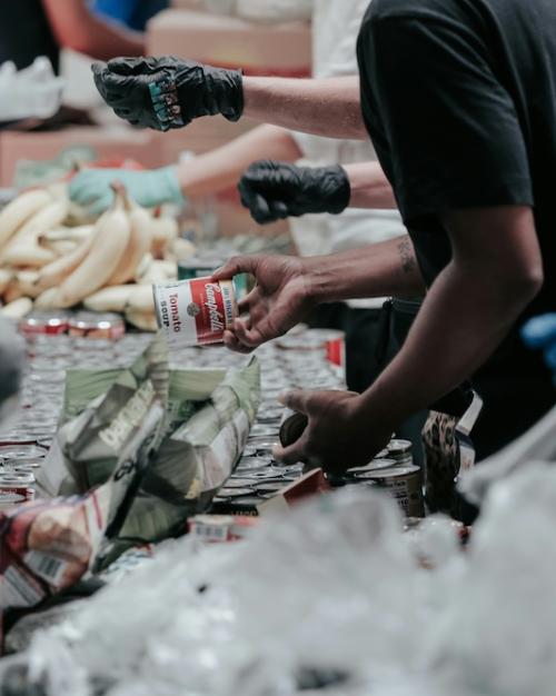 		Many people working together to package food
	