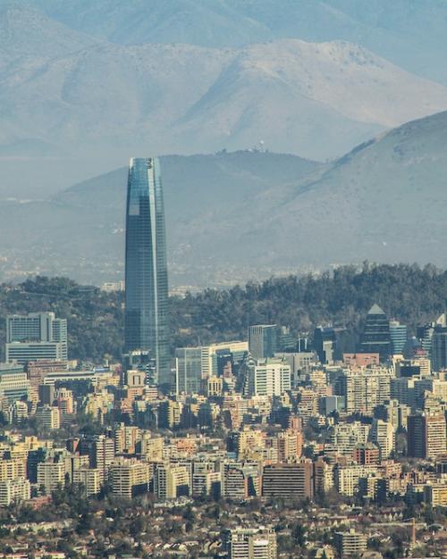 		looking down on a large city set among mountains
	