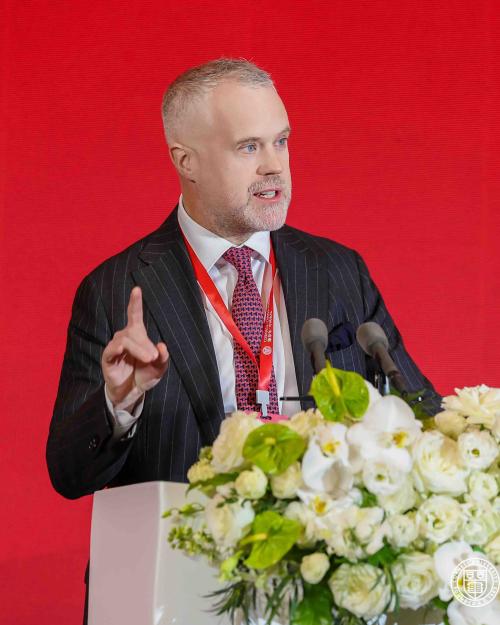 		man speaking at a podium
	