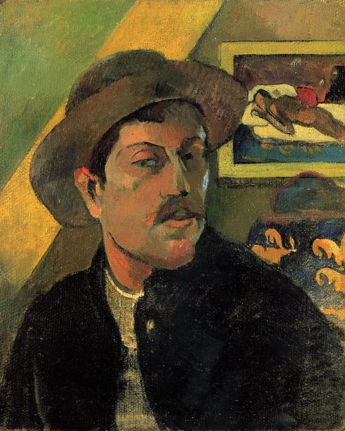 painting by Paul Gauguin showing the artist wearing a hat with a wall and some furniture behind him. On the wall is a framed painting of a person lying on a bed