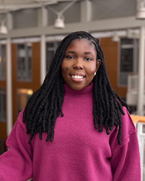 Student standing in front of railing